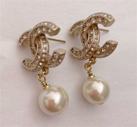 chanel interlocking c earrings with pearl|Chanel earrings.